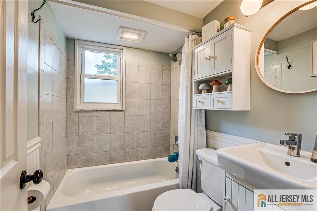 121 East Cliff Road Colonia, NJ 07067 - Photo 21 of 35 a bathroom with a sink a toilet and shower