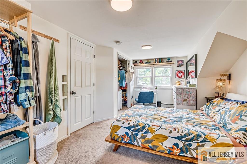 121 East Cliff Road Colonia, NJ 07067 - Photo 23 of 35 a bedroom with a bed and a window