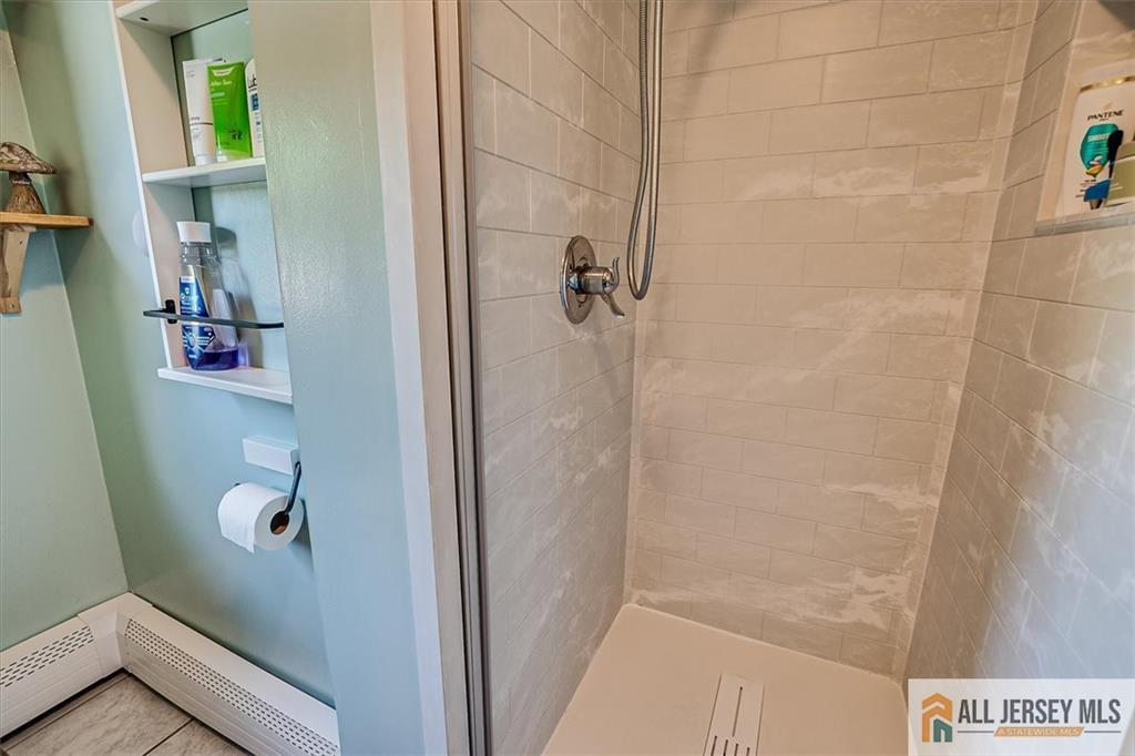 121 East Cliff Road Colonia, NJ 07067 - Photo 28 of 35 a bathroom with a shower