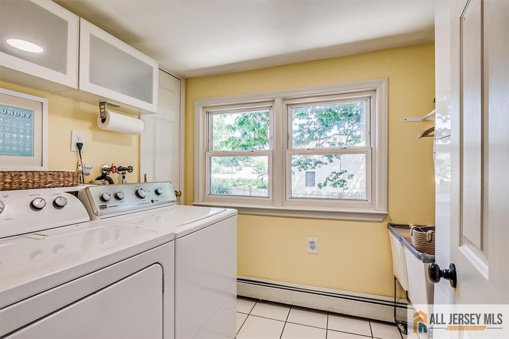 121 East Cliff Road Colonia, NJ 07067 - Photo 29 of 35 a view of washer and dryer with kitchen view