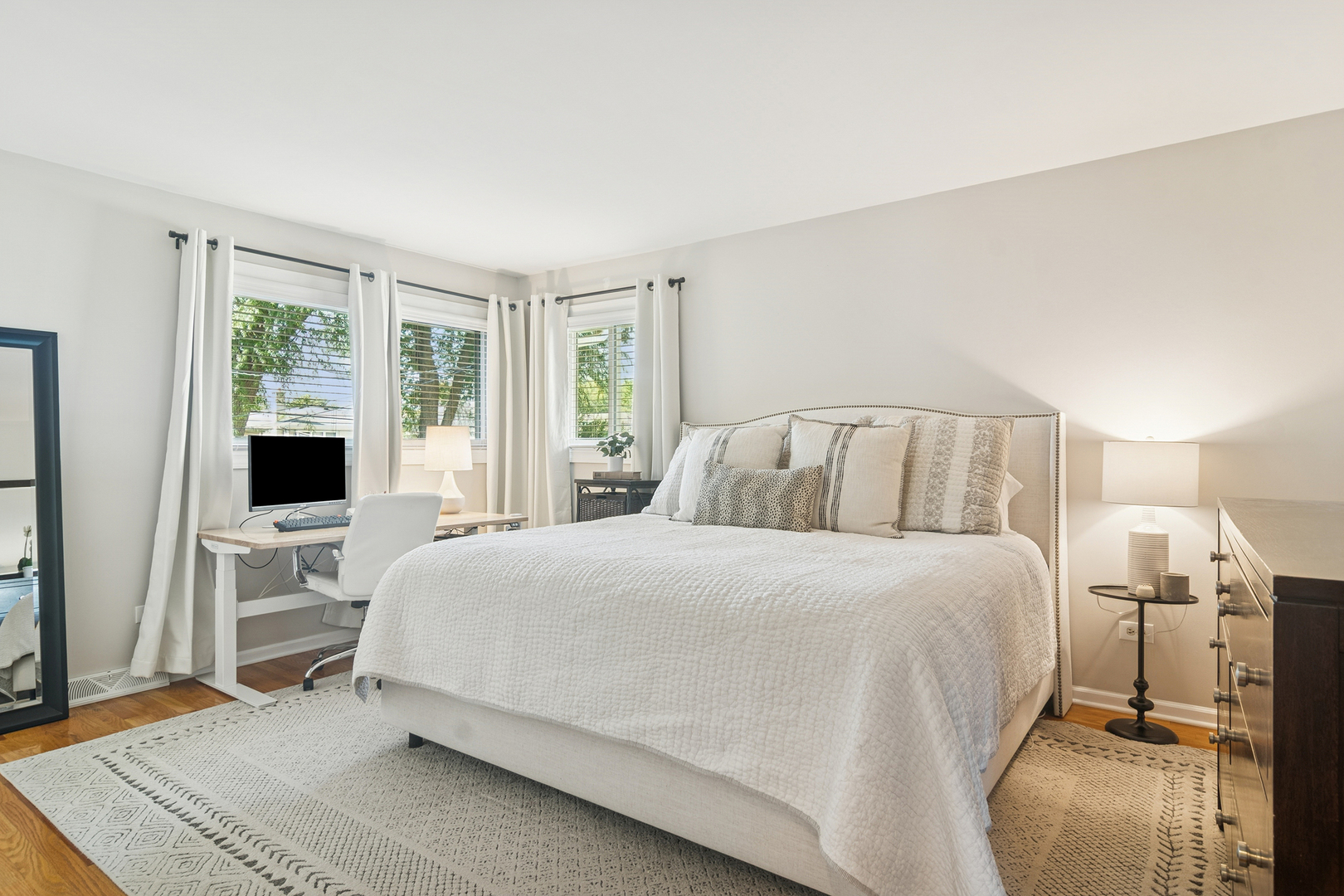 530 North Myrtle Avenue Elmhurst, IL 60126 - Photo 18 of 44 a bedroom with a bed and large flat tv screen