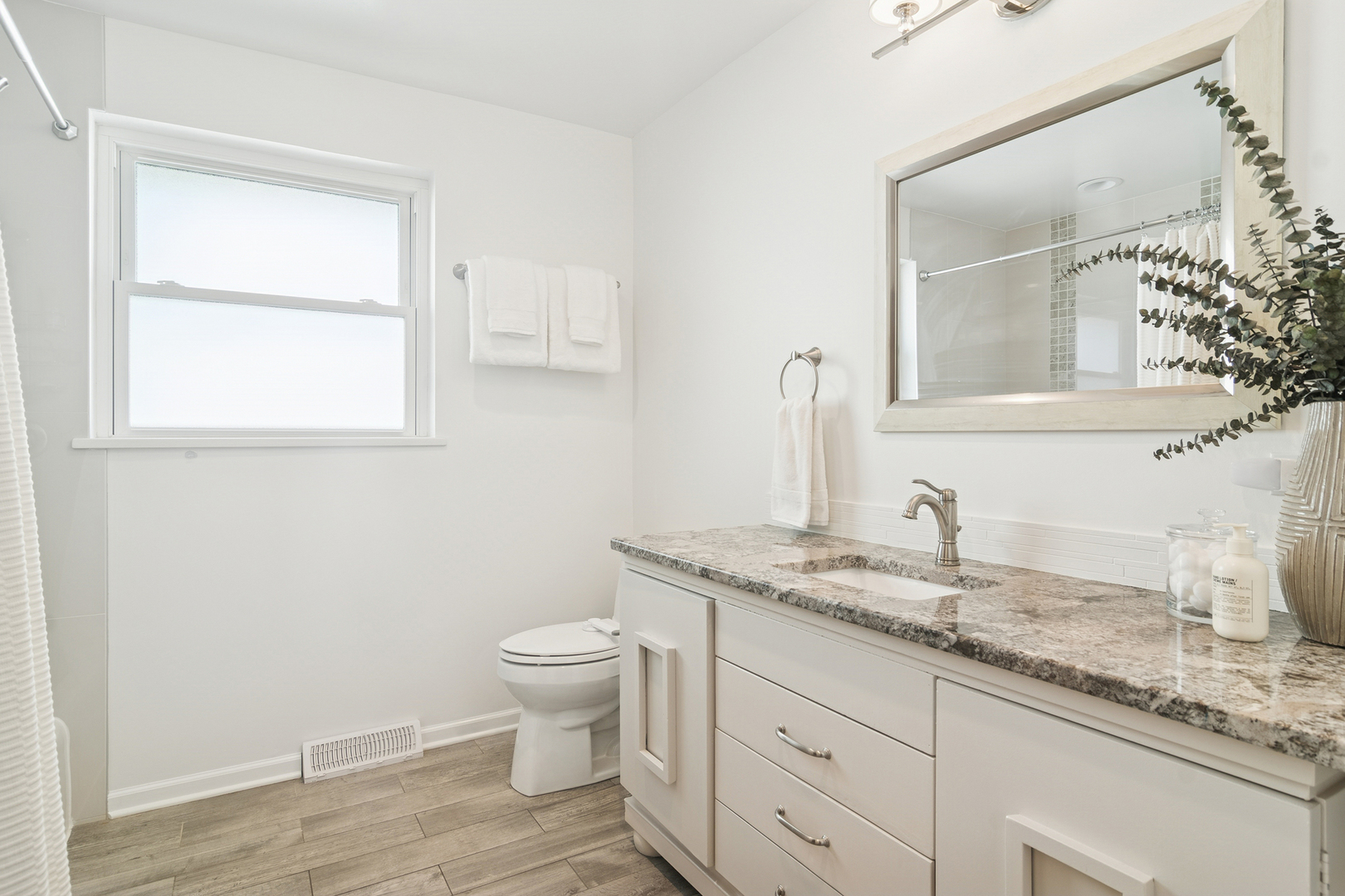 530 North Myrtle Avenue Elmhurst, IL 60126 - Photo 19 of 44 a bathroom with a granite countertop sink toilet and mirror