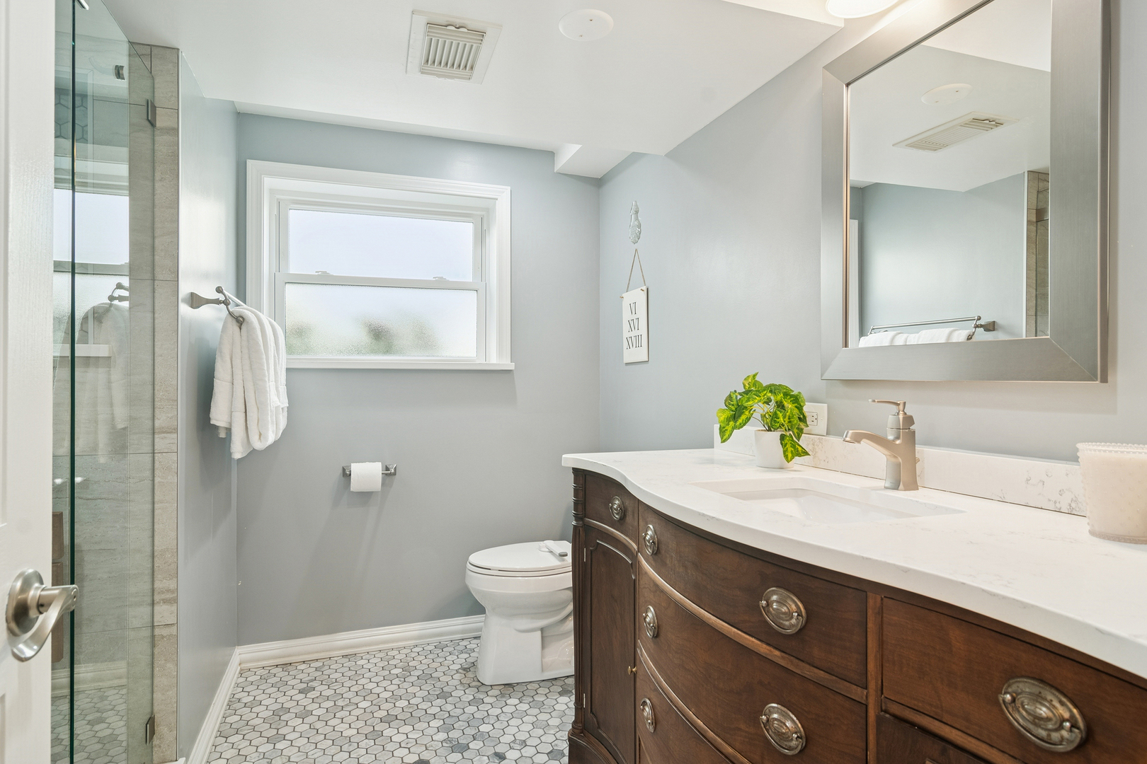 530 North Myrtle Avenue Elmhurst, IL 60126 - Photo 26 of 44 a bathroom with a granite countertop sink a toilet and mirror