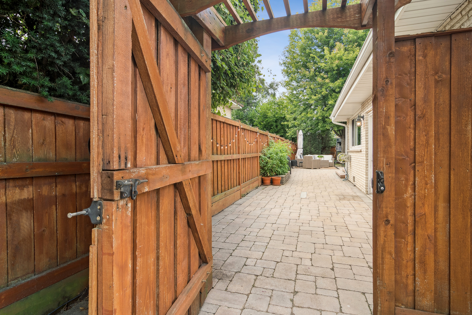 530 North Myrtle Avenue Elmhurst, IL 60126 - Photo 31 of 44 a view of a pathway of a house with wooden floor and fence