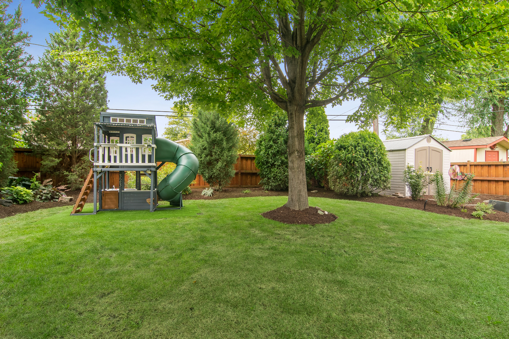 530 North Myrtle Avenue Elmhurst, IL 60126 - Photo 35 of 44 a view of a house with a big yard and large trees
