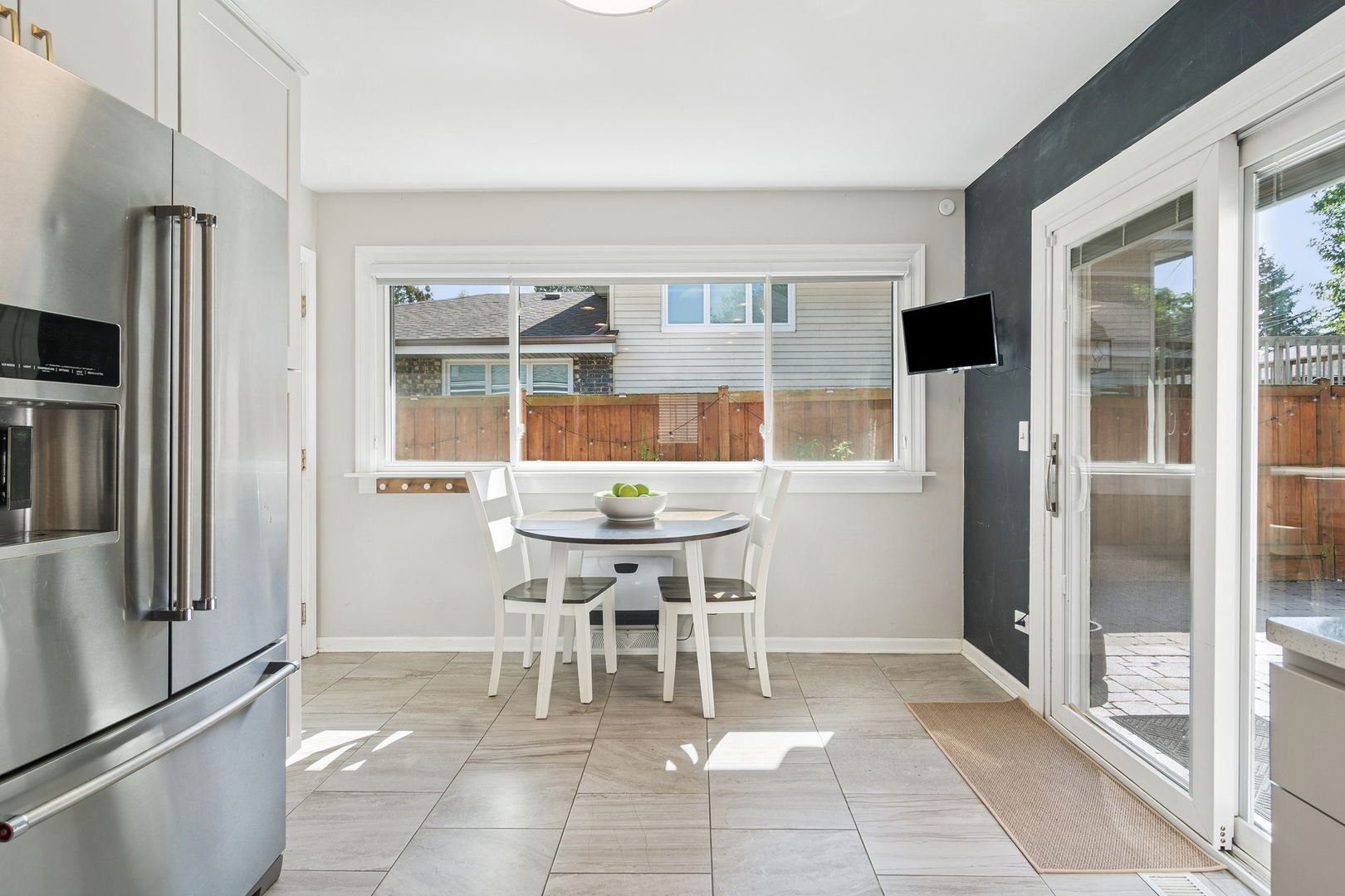 530 North Myrtle Avenue Elmhurst, IL 60126 - Photo 7 of 44 a dining area with stainless steel appliances kitchen island granite countertop a refrigerator and a sink