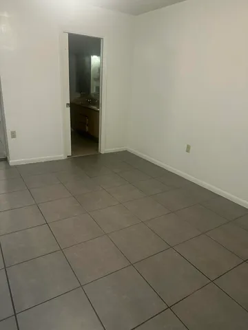 an empty room with a bench