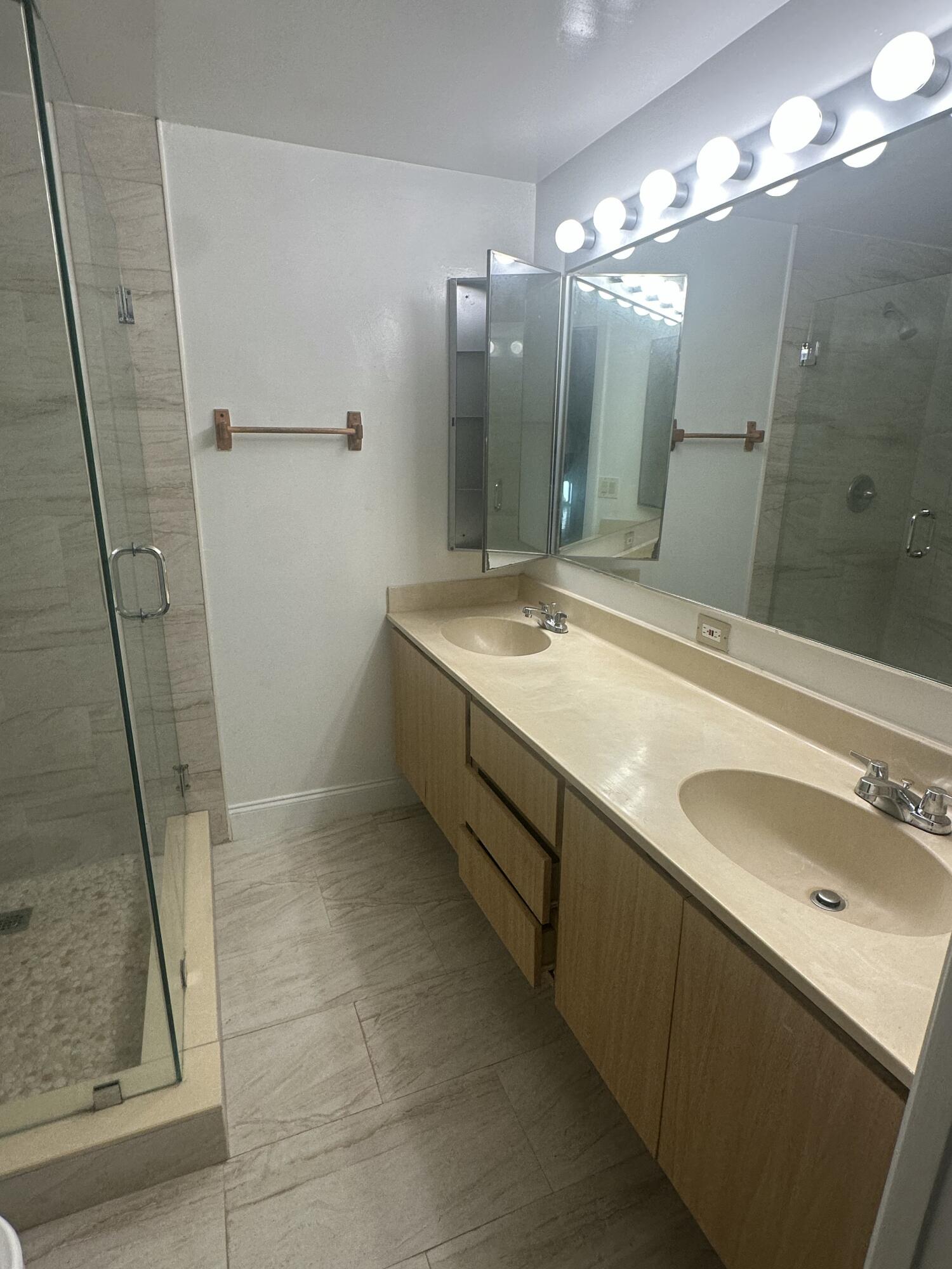 5834 58th Way West Palm Beach, FL 33409 - Photo 12 of 14 a bathroom with a double vanity sink mirror and shower