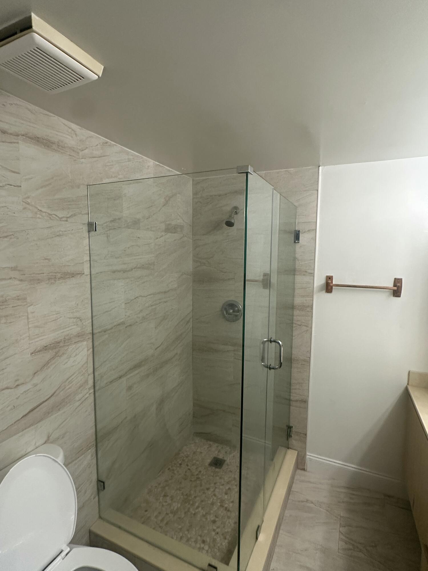 5834 58th Way West Palm Beach, FL 33409 - Photo 13 of 14 a bathroom with a shower and toilet