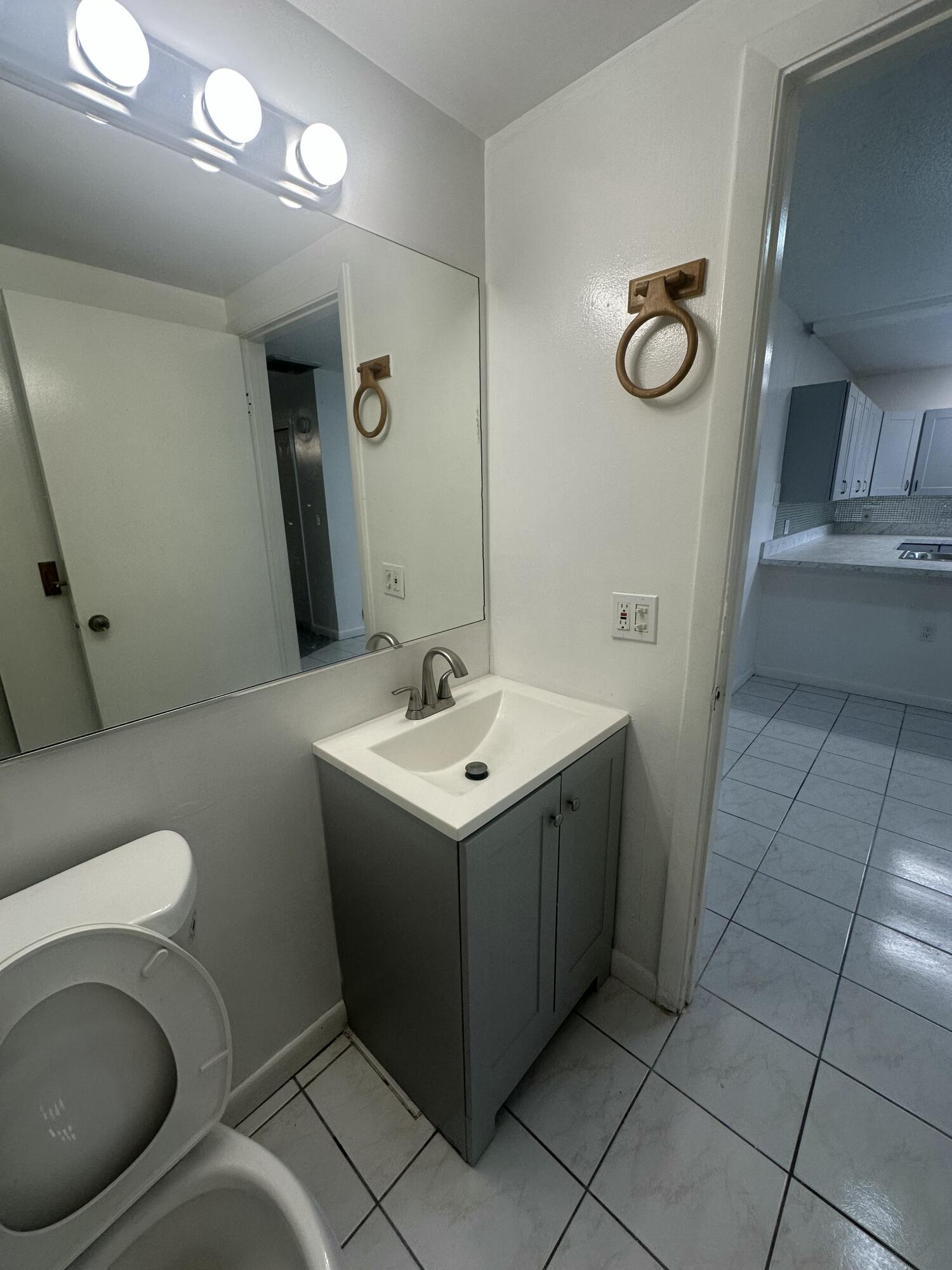 5834 58th Way West Palm Beach, FL 33409 - Photo 7 of 14 a bathroom with a sink and a toilet