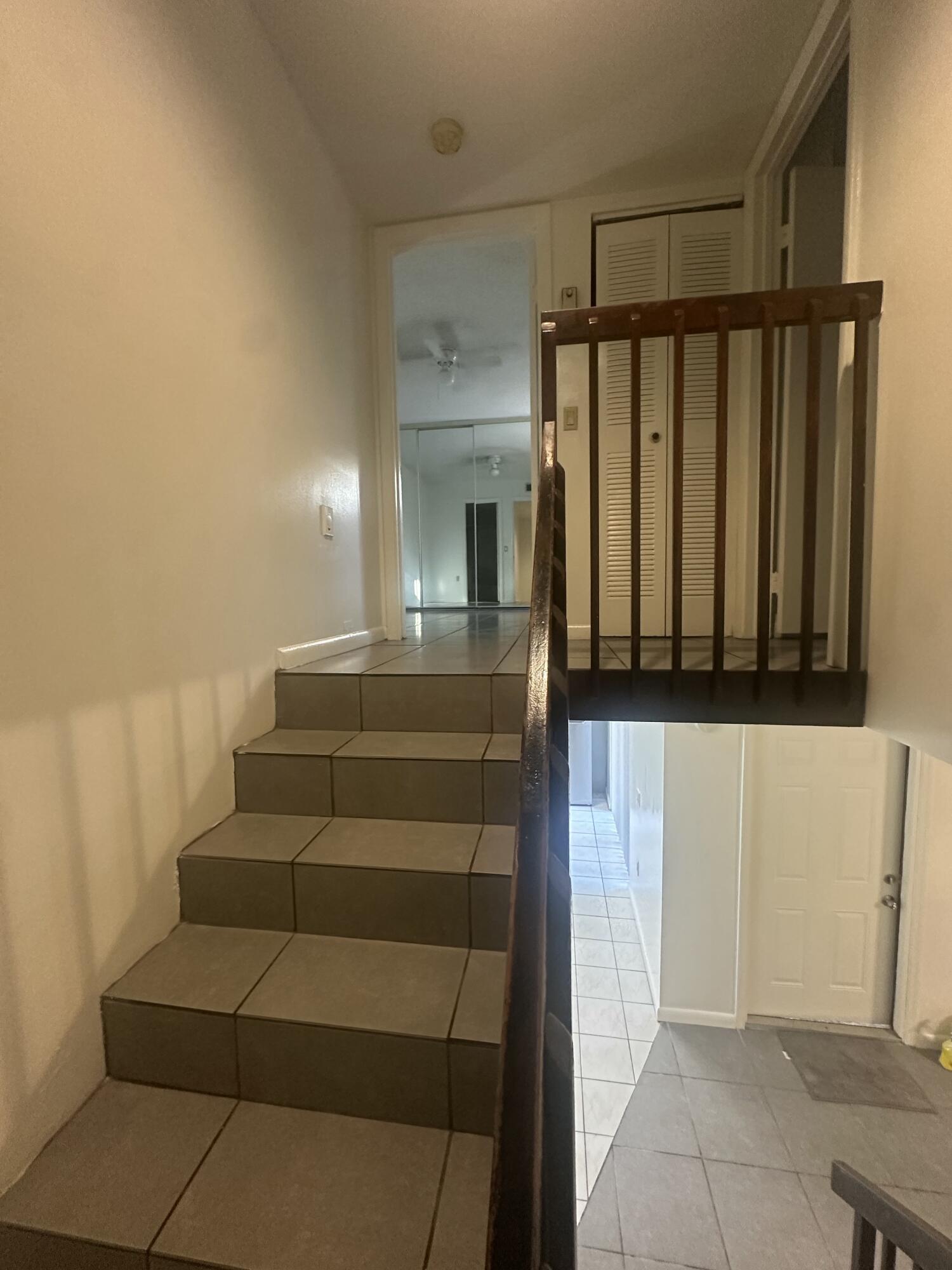 5834 58th Way West Palm Beach, FL 33409 - Photo 9 of 14 a view of entryway with stairs