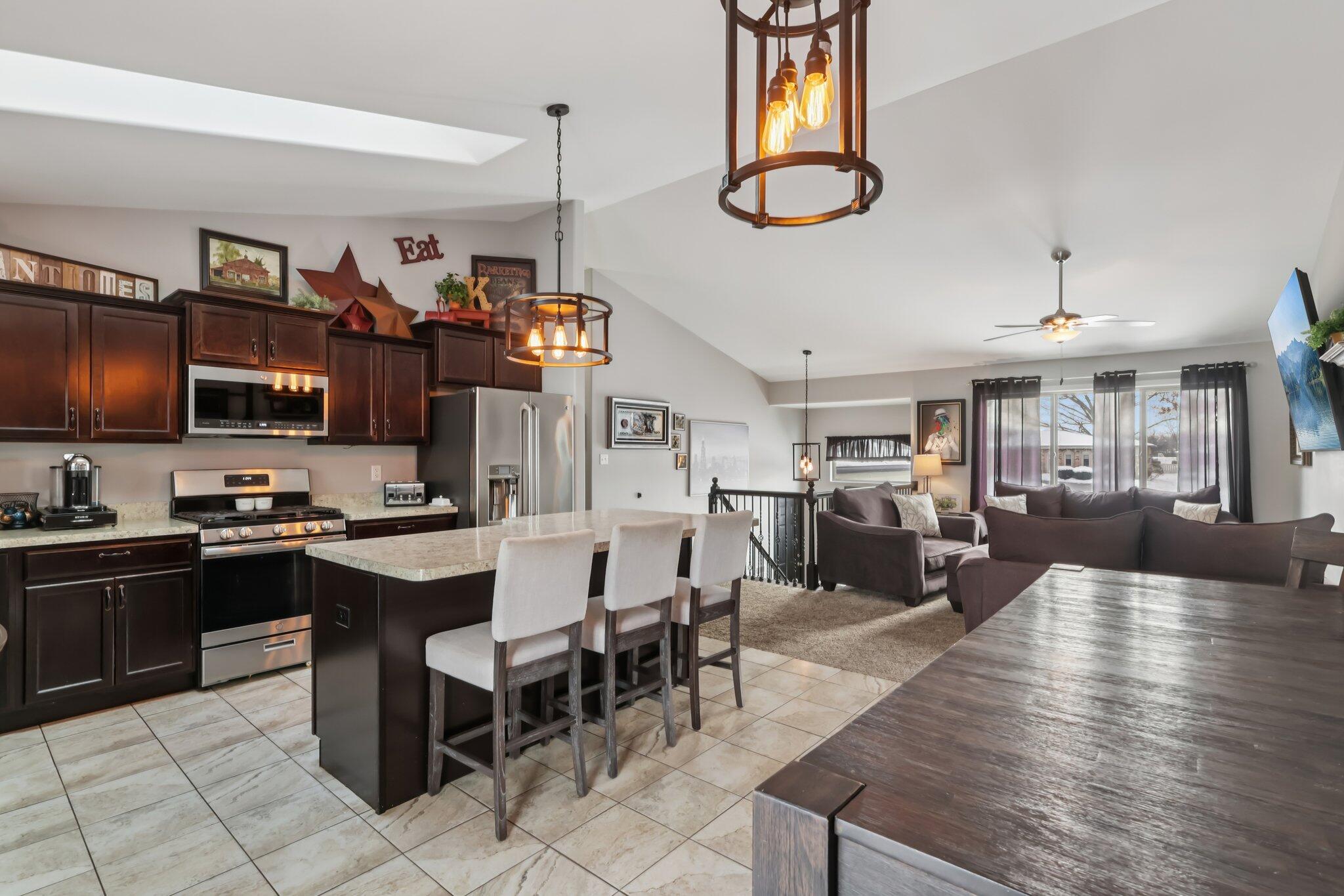 2235 Coldspring Road Crown Point, IN 46307 - Photo 11 of 51 a large kitchen with cabinets table and chairs