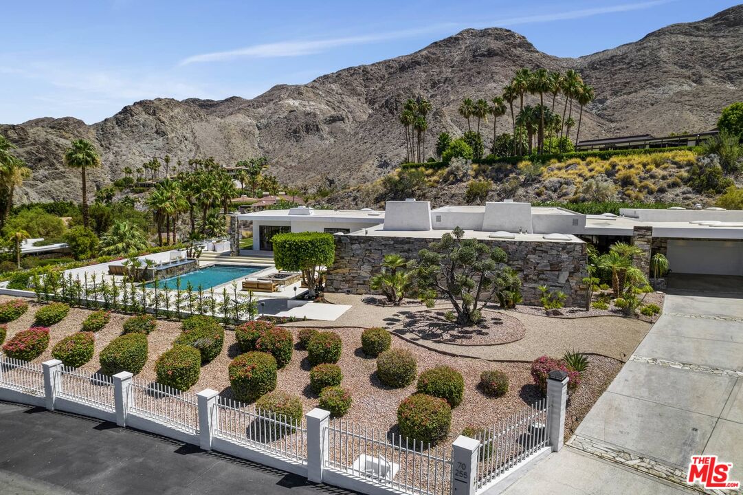 70255 Thunderbird Road Rancho Mirage, CA 92270 - Photo 42 of 53 a view of swimming pool with outdoor seating and mountain view