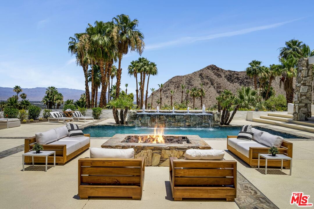70255 Thunderbird Road Rancho Mirage, CA 92270 - Photo 8 of 53 a view of a swimming pool with outdoor seating
