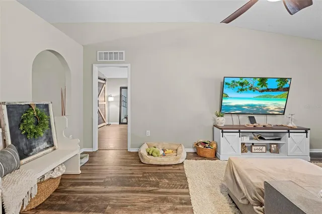 a kitchen view with stainless steel appliances kitchen island granite countertop a sink counter space and cabinets