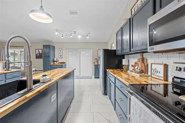 a bed room with a bed and a chandelier