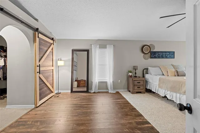 a spacious bathroom with a sink a mirror and a shower