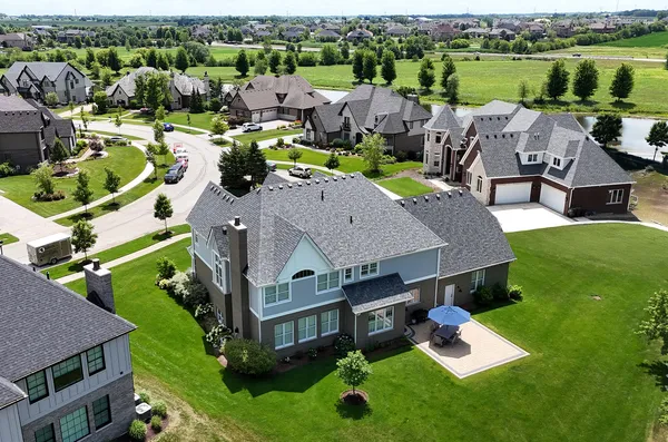 an aerial view of a house with a garden