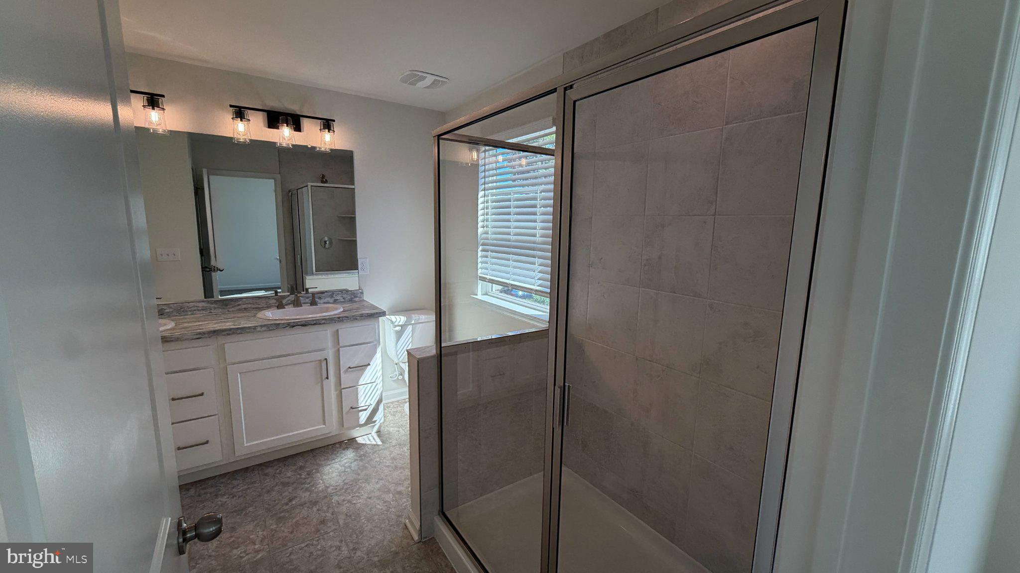 78 Tansboro Road Berlin, NJ 08009 - Photo 24 of 41 a bathroom with a granite countertop sink vanity and mirror