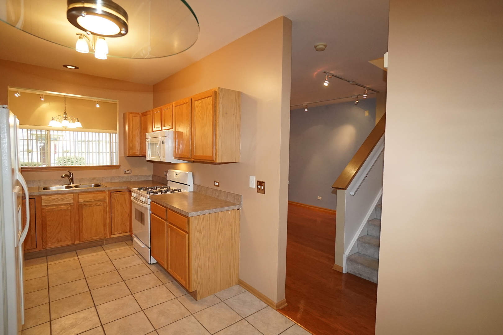 826 County Line Road Aurora, IL 60502 - Photo 9 of 21 a kitchen with stainless steel appliances granite countertop a sink and cabinets