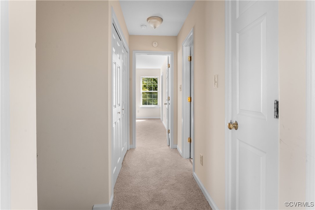 2605 Amherst Ridge Loop Colonial Heights, VA 23834 - Photo 12 of 20 Hallway featuring baseboards and light carpet