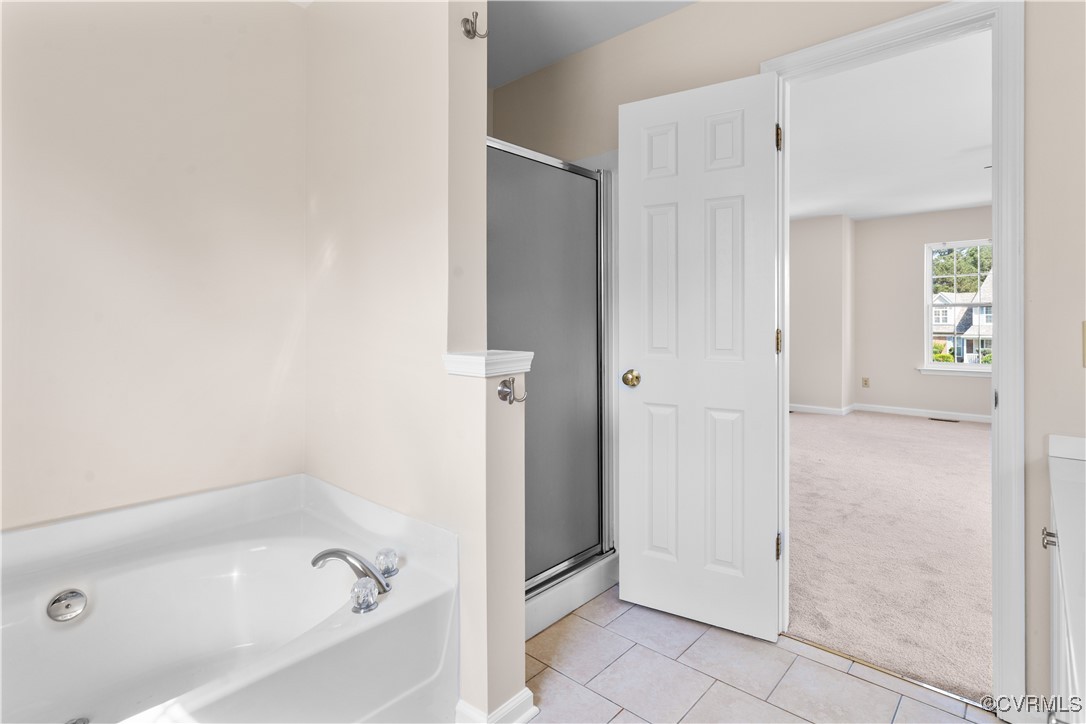 2605 Amherst Ridge Loop Colonial Heights, VA 23834 - Photo 14 of 20 Full bathroom with a shower stall, a bath, baseboa