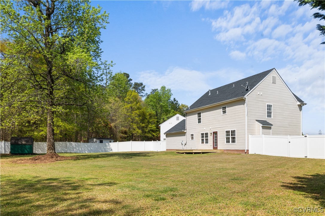 2605 Amherst Ridge Loop Colonial Heights, VA 23834 - Photo 18 of 20 Back of house featuring a fenced backyard, a woode