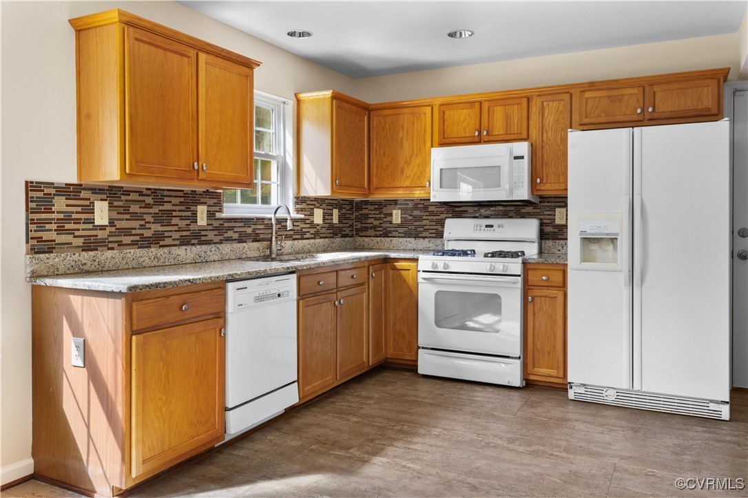 2605 Amherst Ridge Loop Colonial Heights, VA 23834 - Photo 8 of 20 Kitchen with a sink, tasteful backsplash, white ap