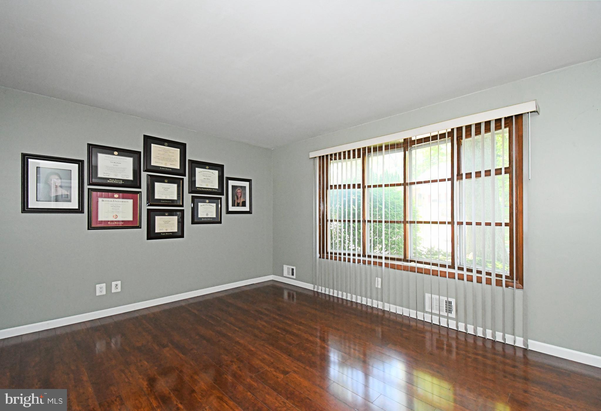 609 Mansfield Road Willow Grove, PA 19090 - Photo 9 of 68 a view of an empty room with wooden floor and a window