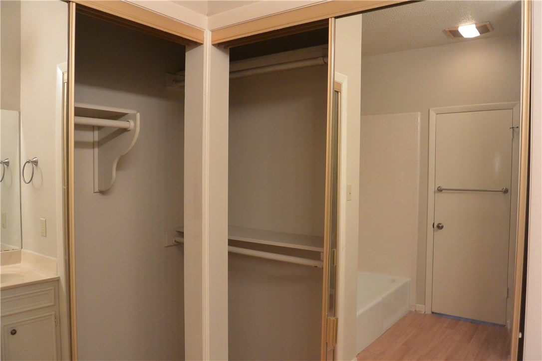 4902 Smokey Valley, Unit A Austin, TX 78731 - Photo 11 of 19 Master bedroom closets have mirrored doors.