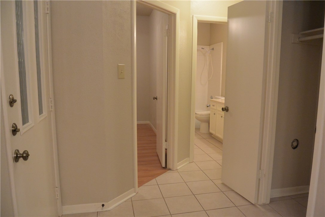 4902 Smokey Valley, Unit A Austin, TX 78731 - Photo 13 of 19 Foyer with tile floors and coat closet.