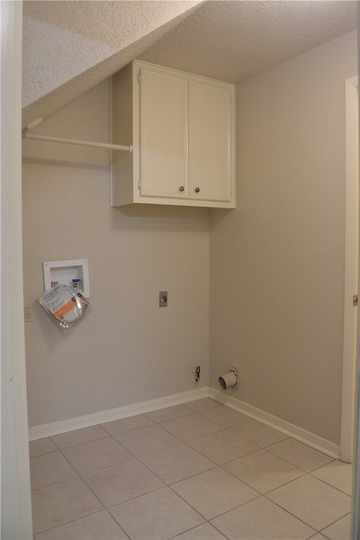 4902 Smokey Valley, Unit A Austin, TX 78731 - Photo 17 of 19 Utility room with 3 prong electric and gas hookup connects foyer to garage entry.