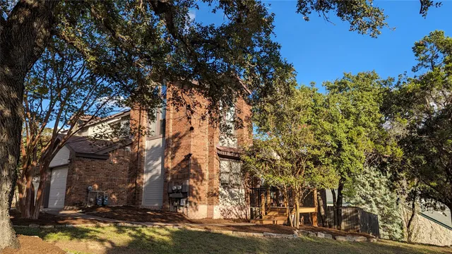 a view of a yard with a tree