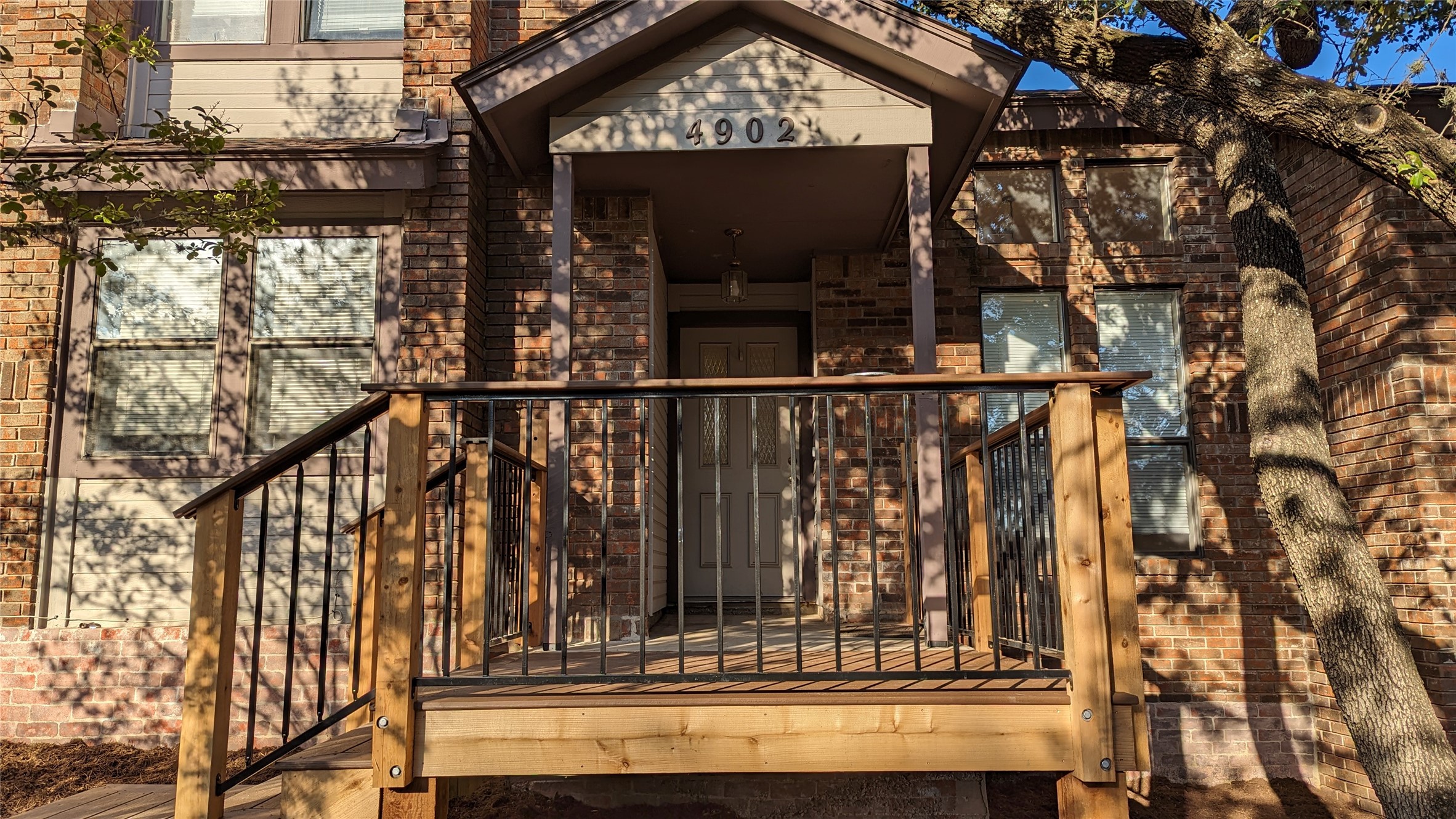 4902 Smokey Valley, Unit A Austin, TX 78731 - Photo 3 of 19 Relax on the front porch deck.