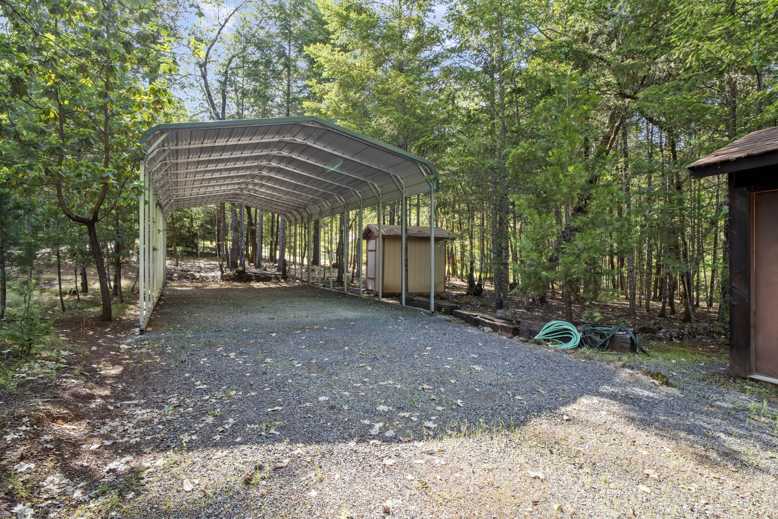 2021 Queens Branch Road Rogue River, OR 97537 - Photo 37 of 37 a view of a backyard with a small cabin