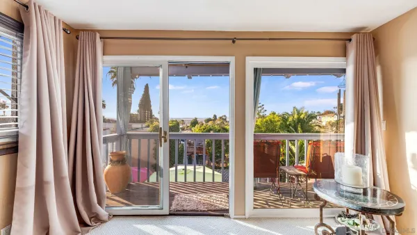 a view of a balcony with chairs