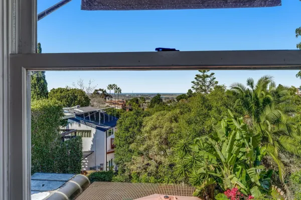 a view of a balcony with plants