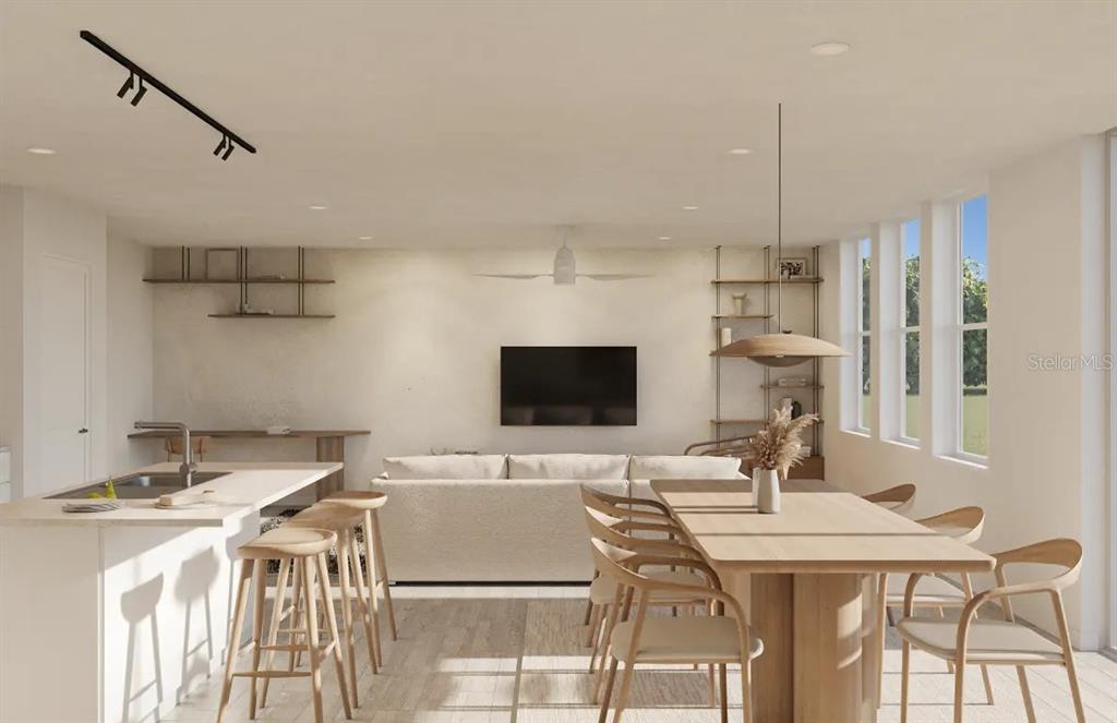 4520 Northwest 37th Street Road Ocala, FL 34482 - Photo 3 of 8 a kitchen with a table chairs a sink dishwasher and cabinets
