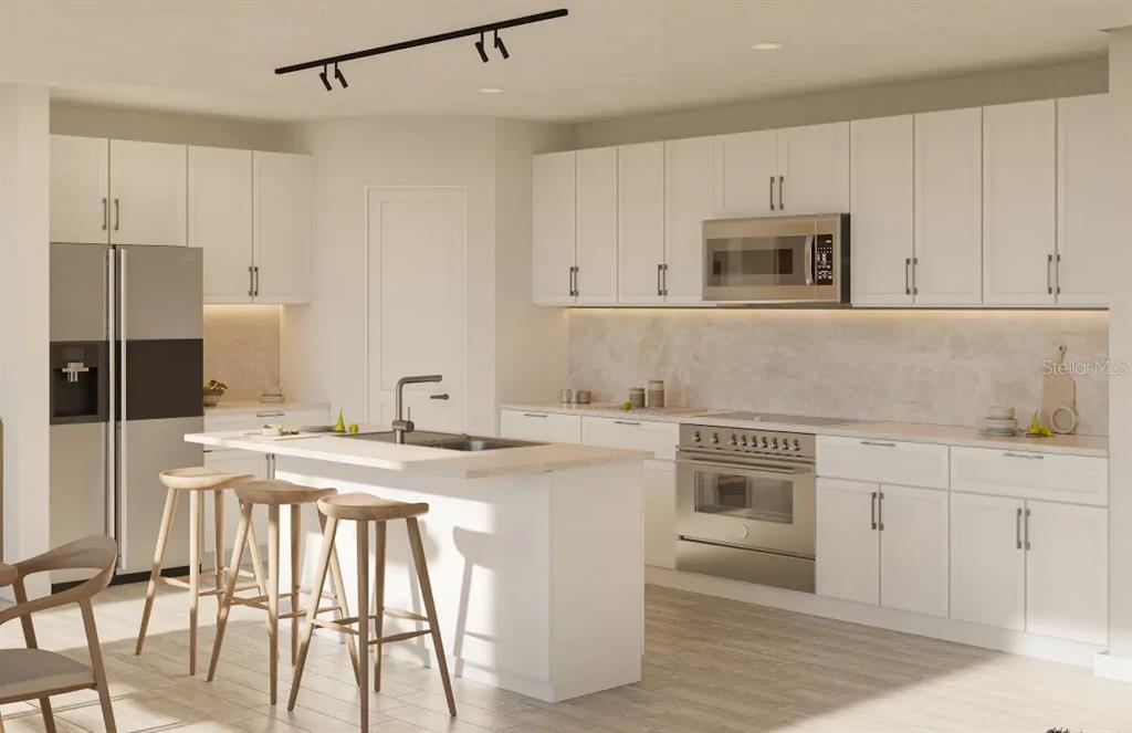 4520 Northwest 37th Street Road Ocala, FL 34482 - Photo 4 of 8 a kitchen with stainless steel appliances granite countertop a stove a sink and white cabinets