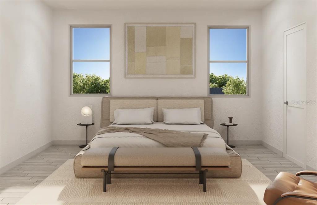 4520 Northwest 37th Street Road Ocala, FL 34482 - Photo 6 of 8 a bedroom with a bed and a potted plant