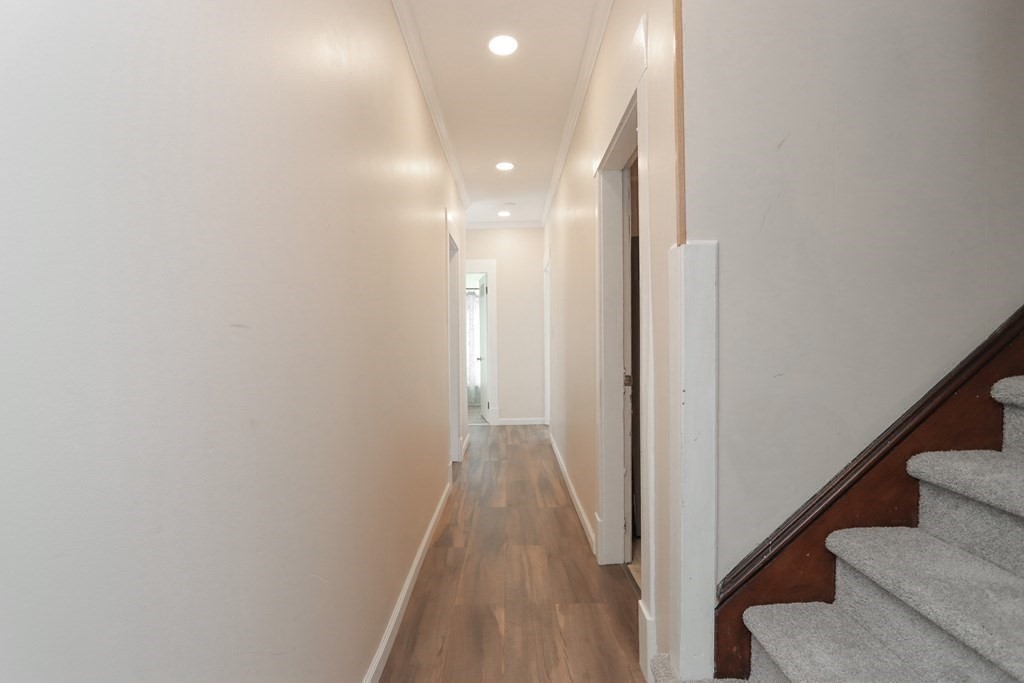 46 Osborne Terrace Springfield, MA 01104 - Photo 15 of 42 a view of a hallway with wooden floor and staircase