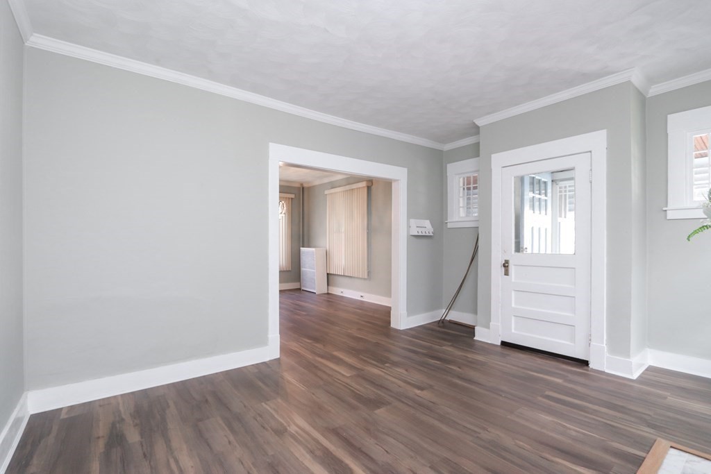 46 Osborne Terrace Springfield, MA 01104 - Photo 3 of 42 an empty room with wooden floor closet and windows