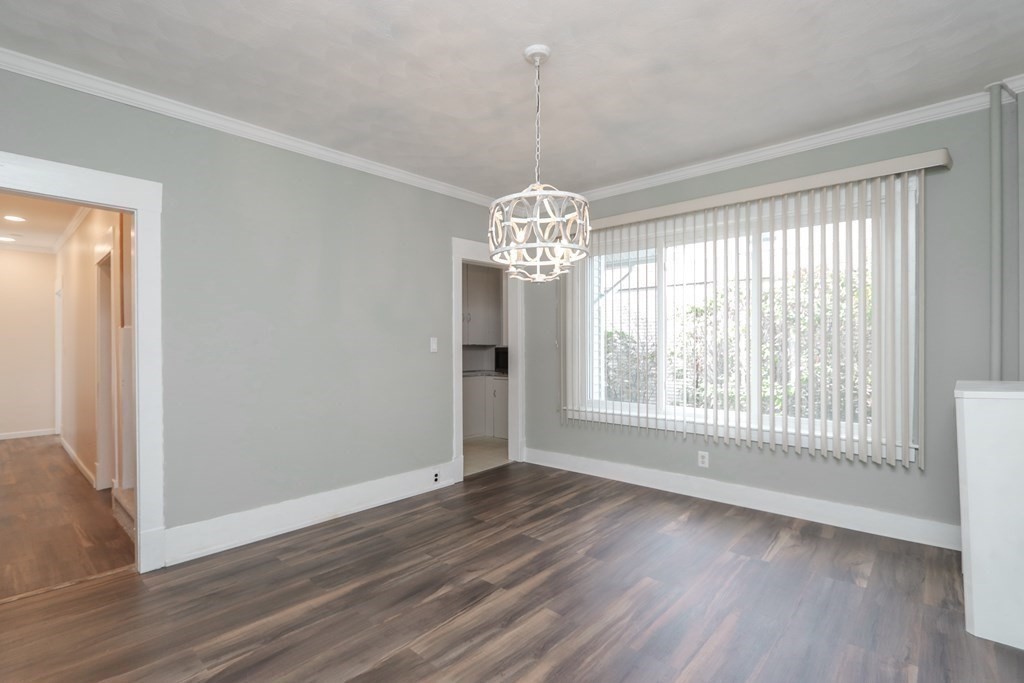 46 Osborne Terrace Springfield, MA 01104 - Photo 8 of 42 a view of an empty room with wooden floor and a window