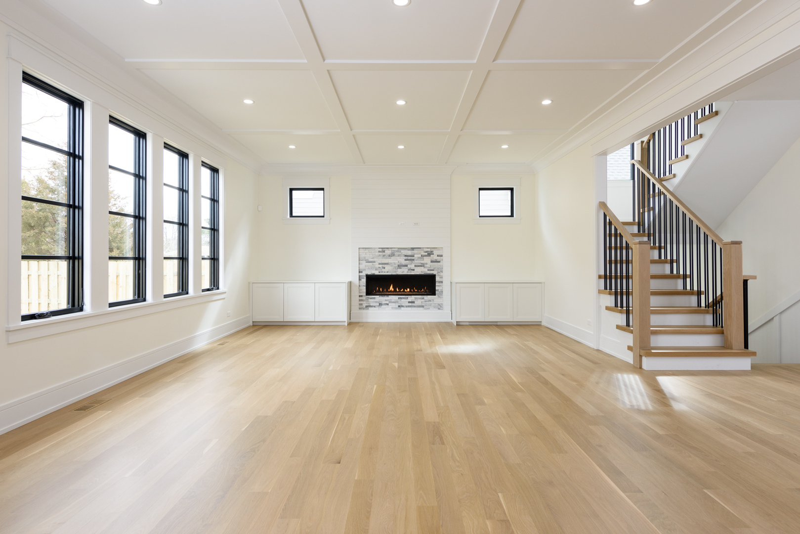 1031 Prairie Lawn Road Glenview, IL 60025 - Photo 6 of 11 a view of an empty room with a fireplace and a window
