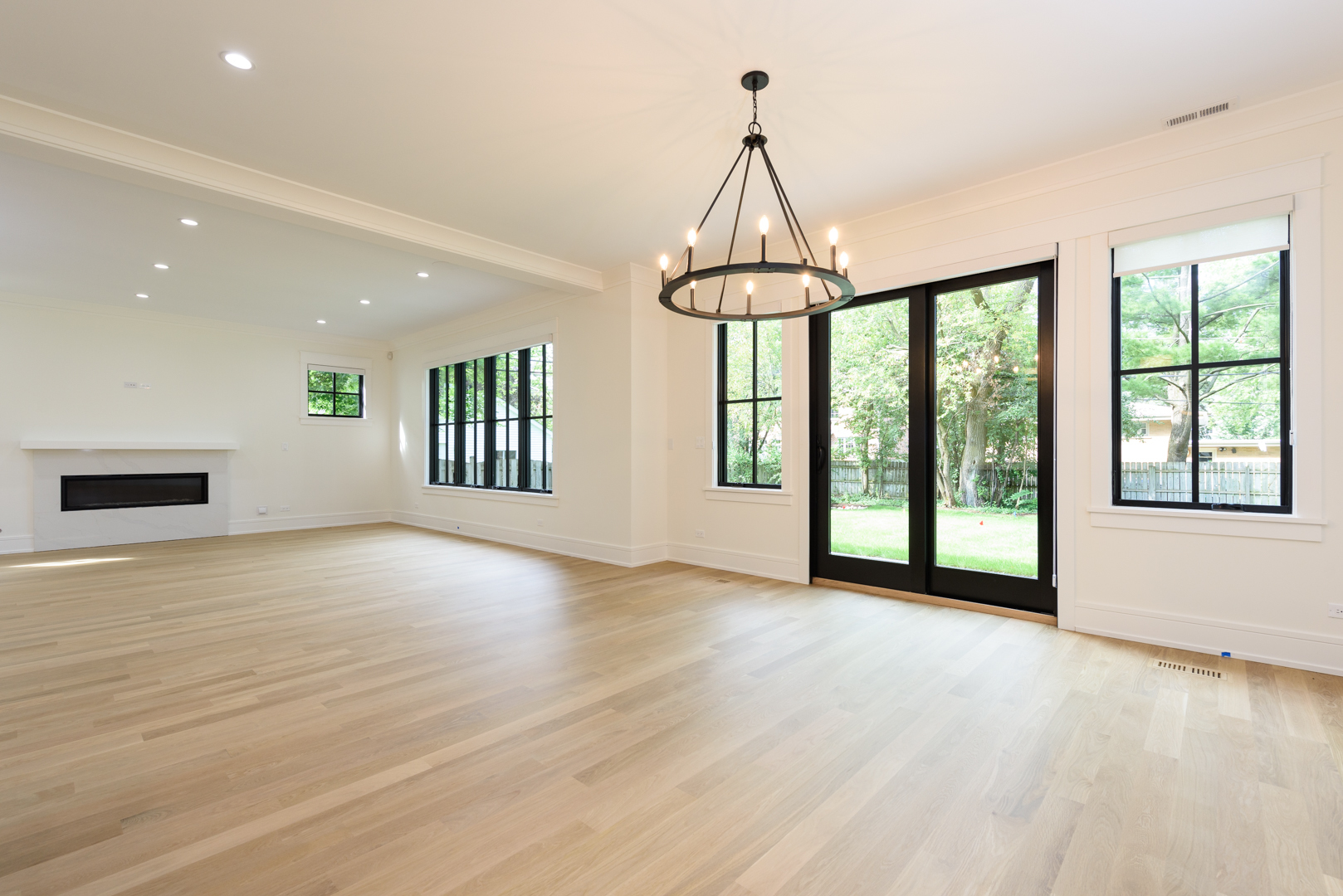 1031 Prairie Lawn Road Glenview, IL 60025 - Photo 9 of 11 a view of an empty room with a window and wooden floor