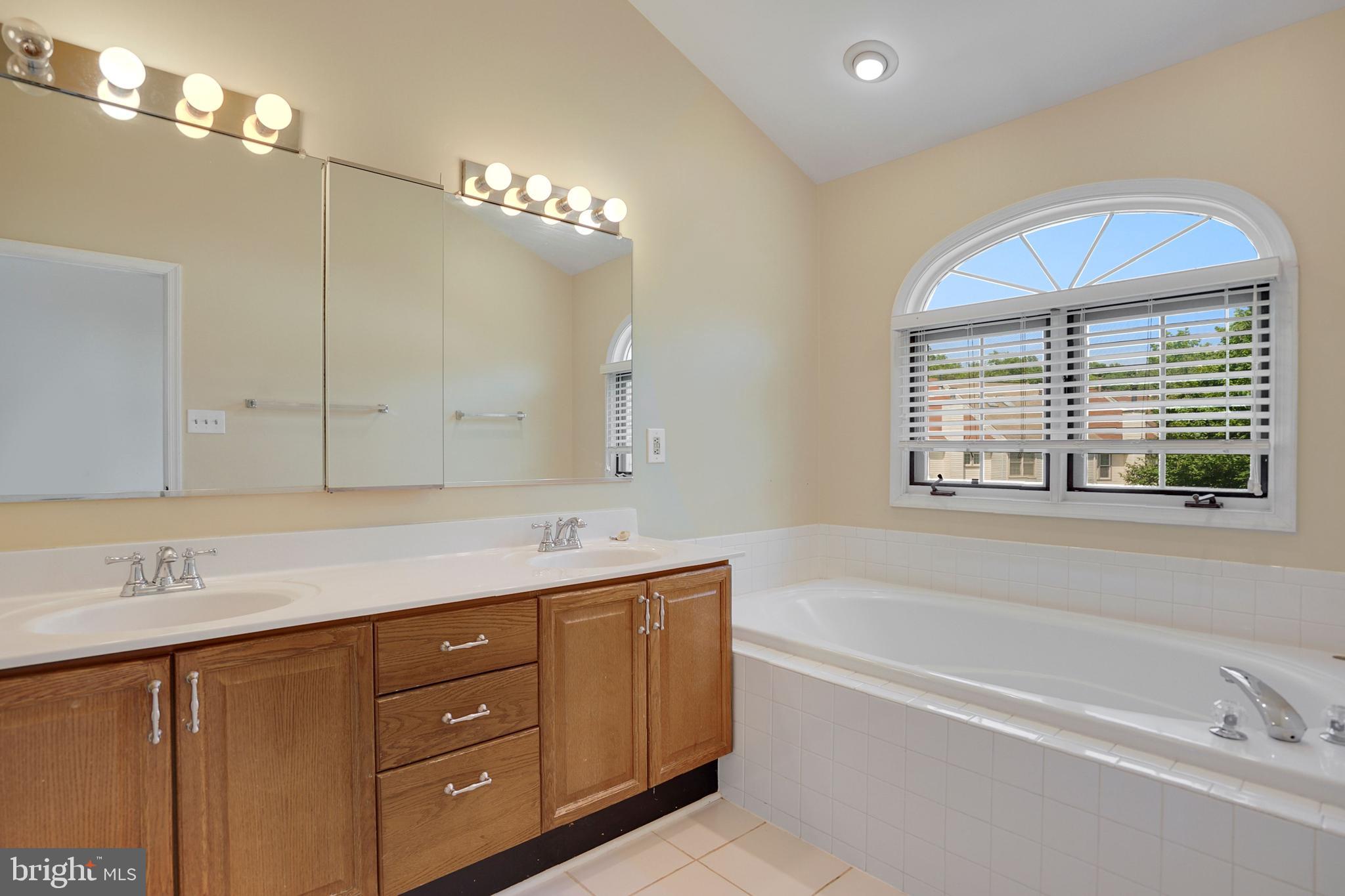 8890 Eagle Rock Lane Springfield, VA 22153 - Photo 23 of 39 Owner's Suite soaking tub and double vanities