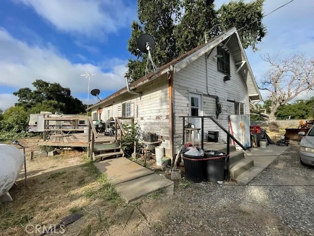 a kitchen with refrigerator and cabinets