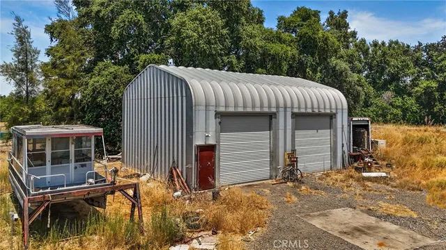 an aerial view of residential house with outdoor space