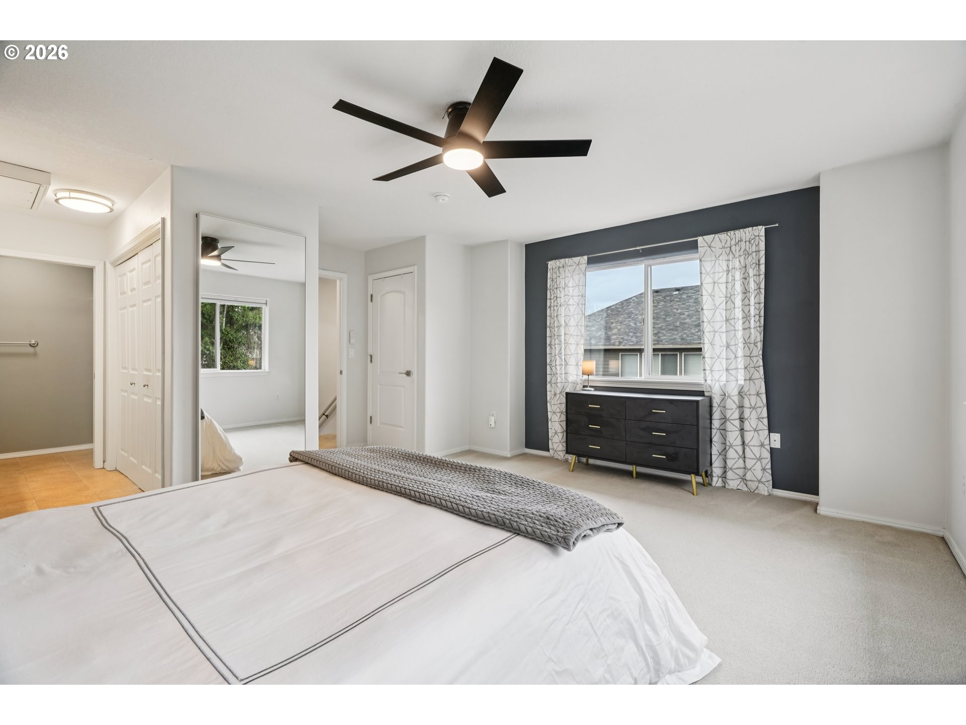 4818 Southwest 2nd Court Portland, OR 97239 - Photo 15 of 26 a bedroom with a bed and a dresser