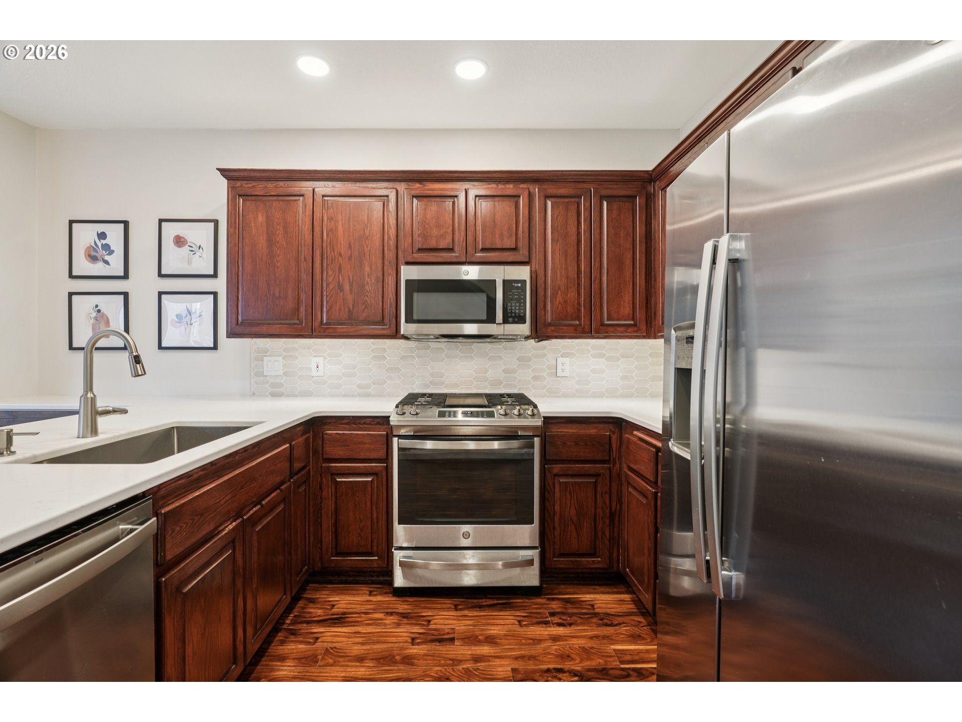 4818 Southwest 2nd Court Portland, OR 97239 - Photo 9 of 26 a kitchen with appliances cabinets and a sink